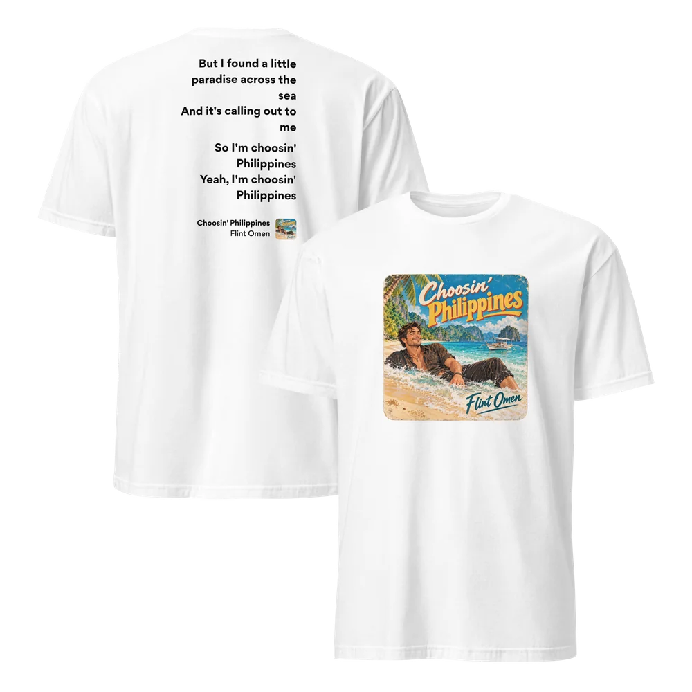 White Choosin’ Philippines T-shirt shown front and back. The front prints the single art: a smiling man lounging in the surf on a tropical beach with a boat and limestone islands behind. The back reads “So I’m choosin’ Philippines” above a small cover badge.